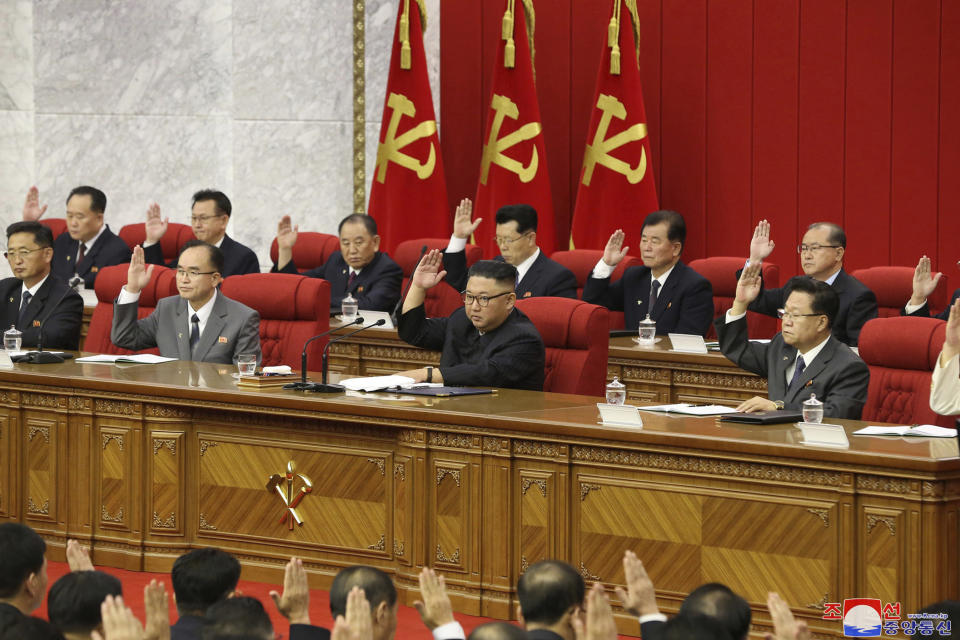 In this photo provided by the North Korean government, North Korean leader Kim Jong Un, center, attends a Workers' Party meeting in Pyongyang, North Korea, Friday, June 18, 2021. Kim ordered his government to be prepared for both dialogue and confrontation with the Biden administration — but more for confrontation — state media reported Friday, days after the United States and others urged the North to abandon its nuclear program and return to talks. Independent journalists were not given access to cover the event depicted in this image distributed by the North Korean government. The content of this image is as provided and cannot be independently verified. (Korean Central News Agency/Korea News Service via AP)