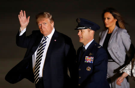 President Donald Trump waves as he arrives with first lady Melania Trump to greet the three Americans formerly held hostage in North Korea, at Joint Base Andrews, Maryland, U.S., May 10, 2018. REUTERS/Jim Bourg