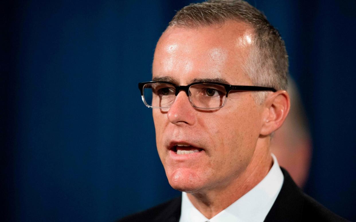 Andrew McCabe was fired from the FBI in March 2018 - AFP