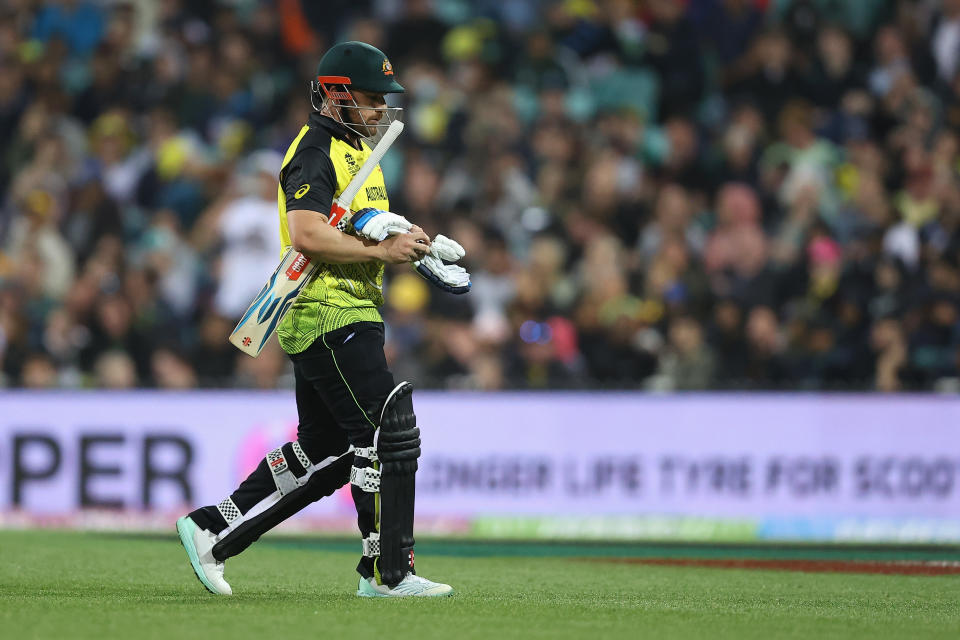 Aaron Finch, pictured here walking off after being dismissed in Australia's clash with New Zealand at the T20 World Cup.