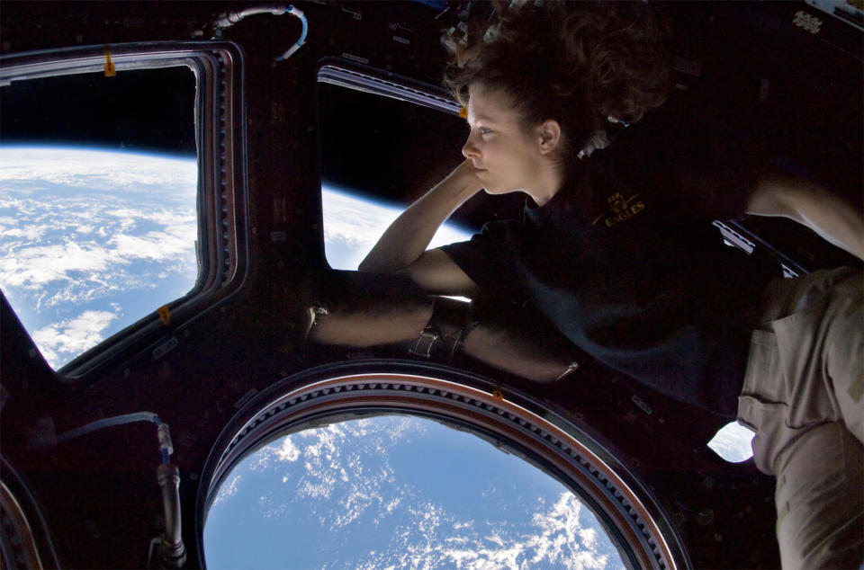 Dyson takes in the spectacular view of Earth from the space station's multi-window dome compartment during his stay at the laboratory complex in 2010.  / Credit: NASA