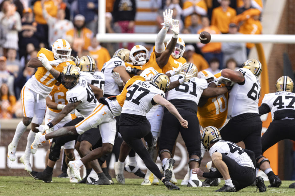 Vanderbilt place kicker Jacob Borcila (97) kicks a field goal as punter Matthew Hayball (45) holds during the first half of an NCAA college football game against TennesseeSaturday, Nov. 25, 2023, in Knoxville, Tenn. (AP Photo/Wade Payne)
