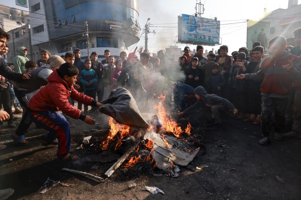 Palestinians burn tires in protest against the rising prices of food and supplies on Feb. 28, 2024, in the Rafah refugee camp in the southern Gaza Strip.