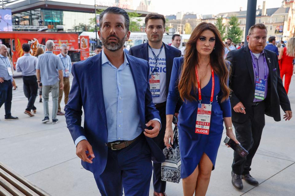 Donald Trump Jr and his partner Kimberly Guilfoyle mingle with attendees (REUTERS)