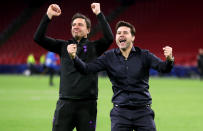 Mauricio Pochettino and Miguel D'Agostino celebrate with the fans after teh astonishing comeback