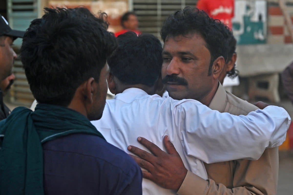 Relatives of religious pilgrims, who died in a truck accident, mourn in Karachi  (AFP/Getty)