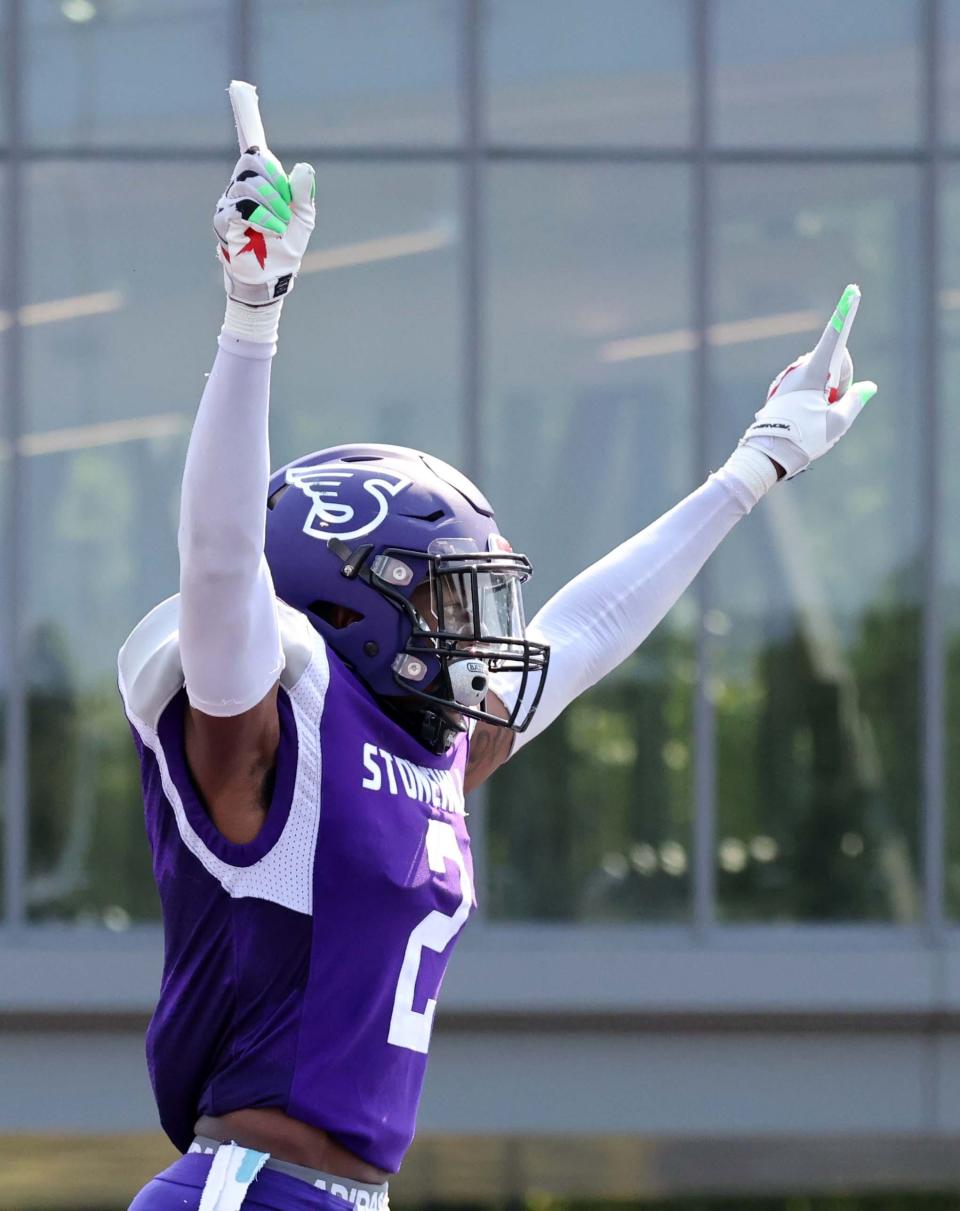 Stonehill's Kevin Porch celebrates a turnover of downs during a game versus Post University on Saturday, Sept. 10, 2022. 