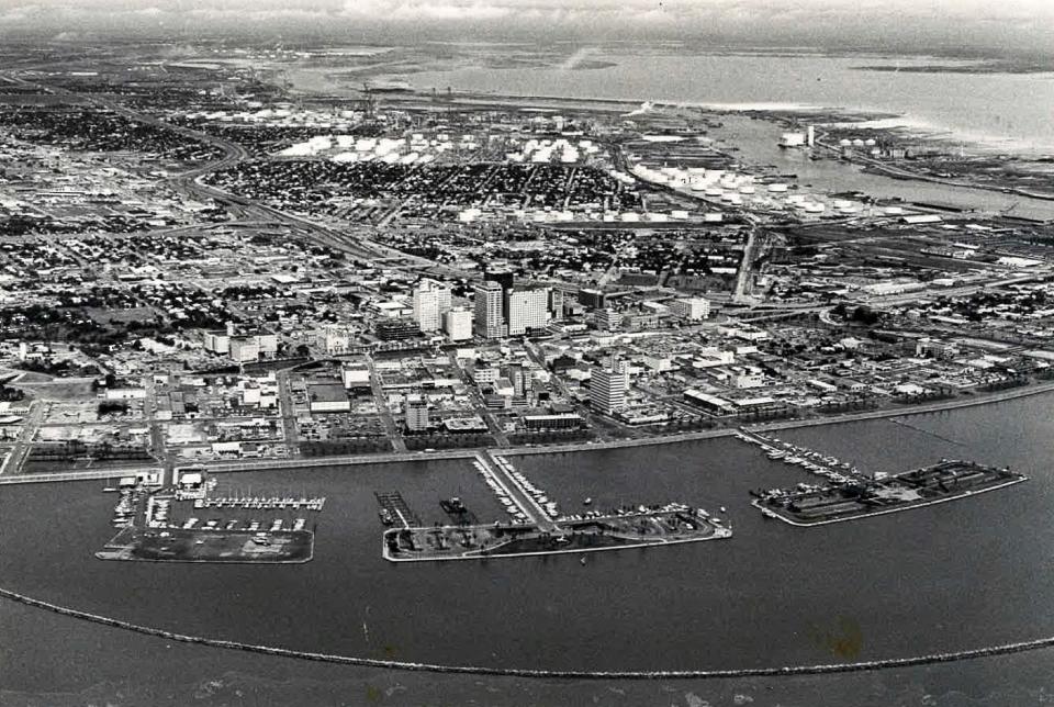 A 1972 aerial photo from Corpus Christi Bay overlooking downtown, seen in the front, the West Side in back, and the Port of Corpus Christi on the right.