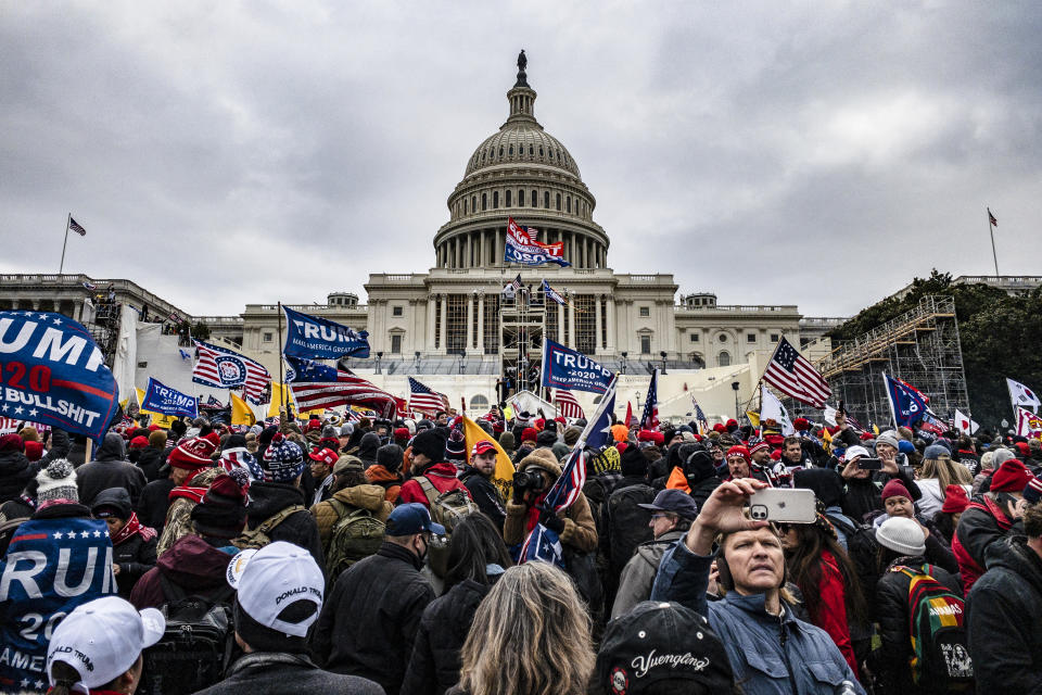 Pro-Trump supporters storm the U.S. Capitol following a rally with President Donald Trump on Jan. 6, 2021. (Samuel Corum / Getty Images file)