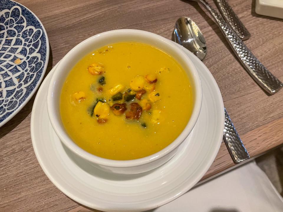 A bowl of corn and poblano soup.