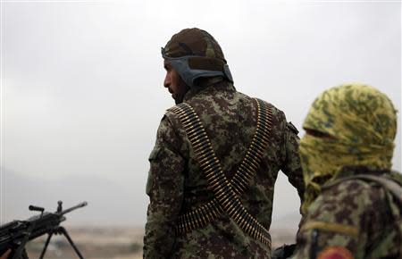 Afghan National Army soldiers keep watch near the site of a gunfight on the outskirts of Kabul October 26, 2013. REUTERS/Mohammad Ismail