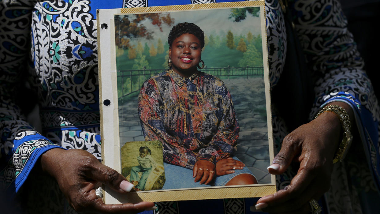 Antoinette Dorsey-James holds a picture of her sister Pamela Turner