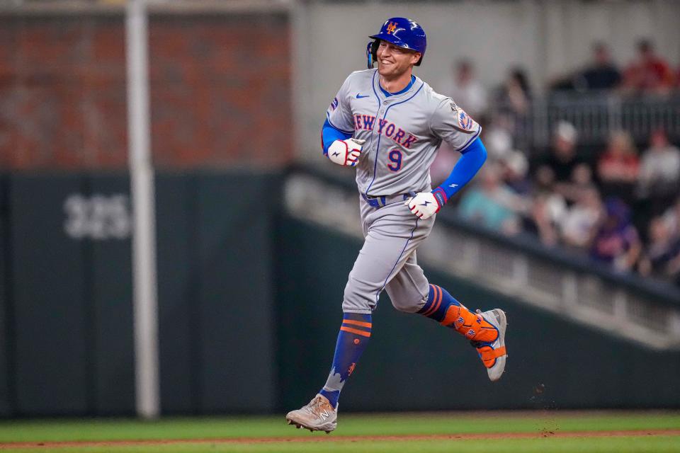 New York Mets center fielder Brandon Nimmo (9) reacts after hitting a home run against the Atlanta Braves during the seventh inning on April 8, 2024, at Truist Park.
