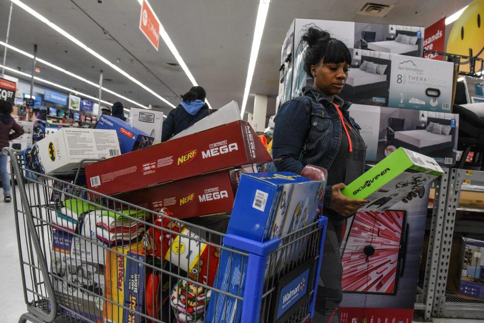 A woman shops at Walmart near the Green Acres Mall in Valley Stream, N.Y.