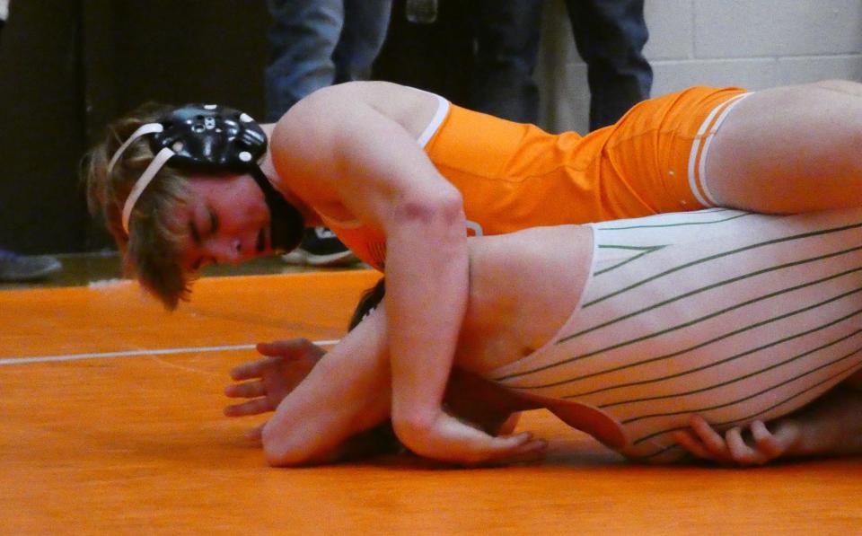 Heath senior Riley Gould works on top against Barnesville senior Caiden Thornton at 150 pounds during Heath's Robin Drumm Classic on Saturday, Jan. 22, 2022. Gould won the title on his home mats.