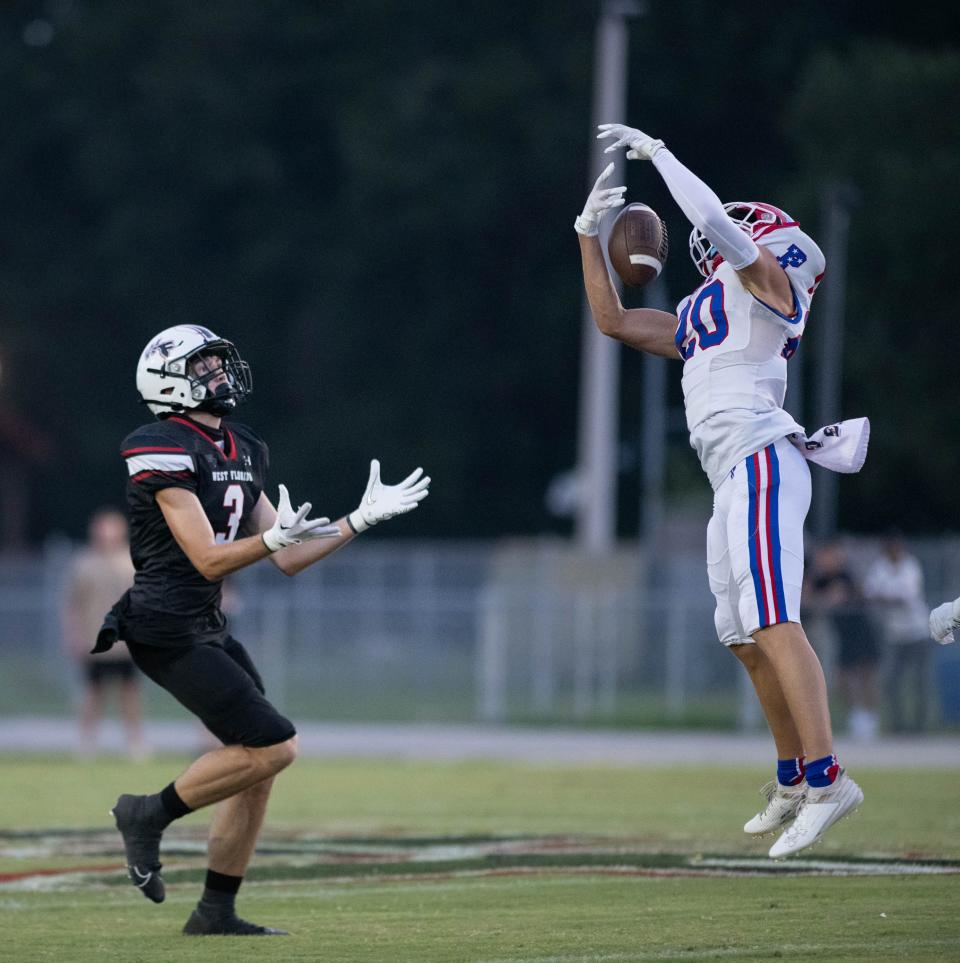 Carson Wright (20) intercepts the pass intended for Josh Spears (3) during the Pace vs West Florida football game at West Florida High School in Pensacola on Friday, Sept. 8, 2023.