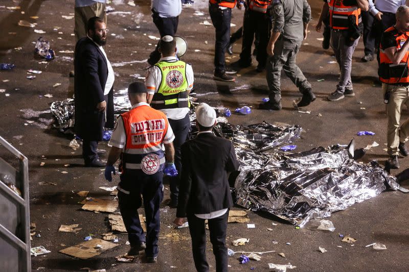 FILE PHOTO: Medics and rescue workers attend to the Lag B'Omer event in Mount Meron, northern Israel, where fatalities were reported among the thousands of ultra-Orthodox Jews gathered