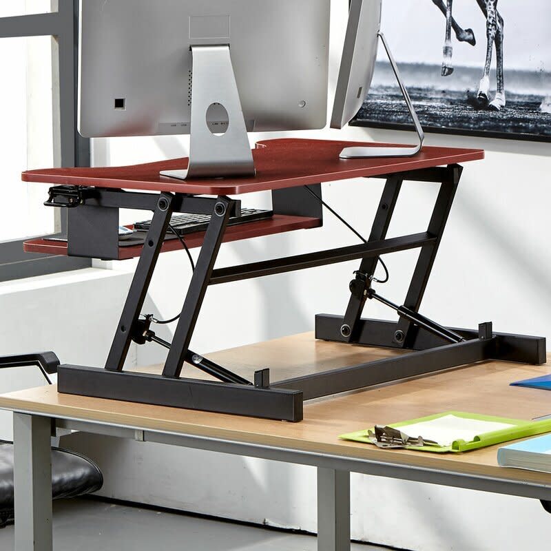 Find this <a href="https://fave.co/3fOhDig" target="_blank" rel="noopener noreferrer">easy-pull home office standing desk converter</a> for $164 at <a href="https://fave.co/3fOhDig" target="_blank" rel="noopener noreferrer">Wayfair</a>. <br /><strong>Ratings</strong>: 4.6 stars<br /><strong>Reviews</strong>: More than 50