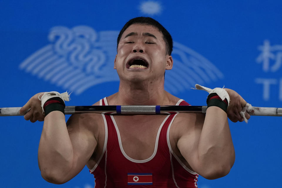 North Korea's Ro Kwangryol competes on his way to silver at the Weightlifting Men's 96Kg competition at the 19th Asian Games in Hangzhou, China, Thursday, Oct. 5, 2023. (AP Photo/Ng Han Guan)