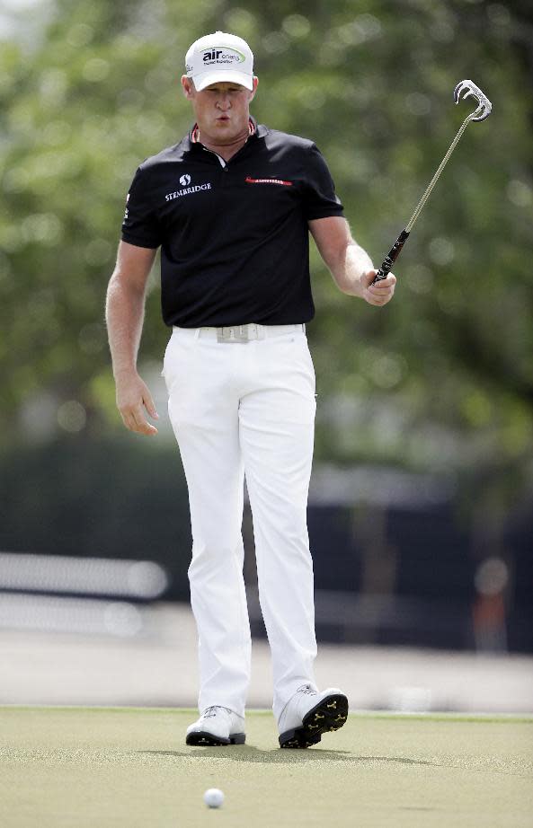 Jamie Donaldson of Wales reacts after missing the second hole during the final round of the Cadillac Championship golf tournament Sunday, March 9, 2014, in Doral, Fla. Donaldson made par. (AP Photo/Wilfredo Lee)