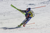 Greece's Aj Ginnis crosses the finish line to win the silver medal in the men's World Championship slalom, in Courchevel, France, Sunday Feb. 19, 2023. (AP Photo/Marco Trovati)