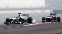 Mercedes Formula One driver Nico Rosberg of Germany (L) and Mercedes Formula One driver Lewis Hamilton of Britain drive during the qualifying session of the Indian F1 Grand Prix at the Buddh International Circuit in Greater Noida, on the outskirts of New Delhi, October 26, 2013. REUTERS/Ahmad Masood (INDIA - Tags: SPORT MOTORSPORT F1)