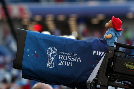 A Paddington Bear stuffed toy sits on a TV camera during the England vs Belgium match at Kaliningrad Stadium, Kaliningrad, Russia, June 28, 2018. REUTERS/Mariana Bazo