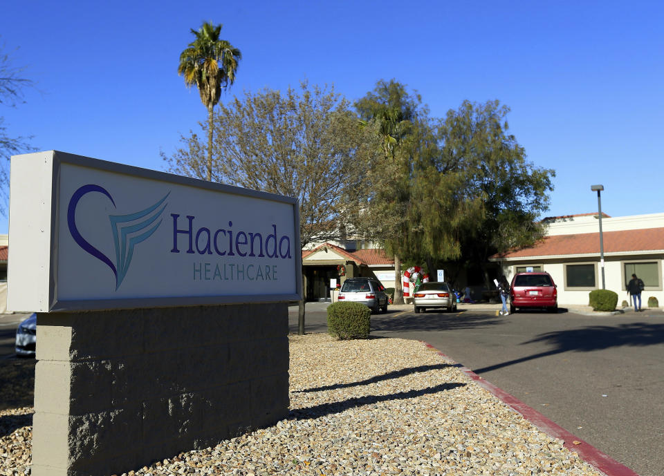 FILE - This Friday, Jan. 4, 2019, file photo, shows Hacienda HealthCare in Phoenix. Arizona's governor is looking into whether the state can remove the board of directors of a long-term care facility where a nurse is accused of raping an incapacitated woman who later gave birth. In a flurry of tweets Friday, Jan. 25, 2019, Gov. Doug Ducey called for Hacienda HealthCare's board to be fired. (AP Photo/Ross D. Franklin, File)