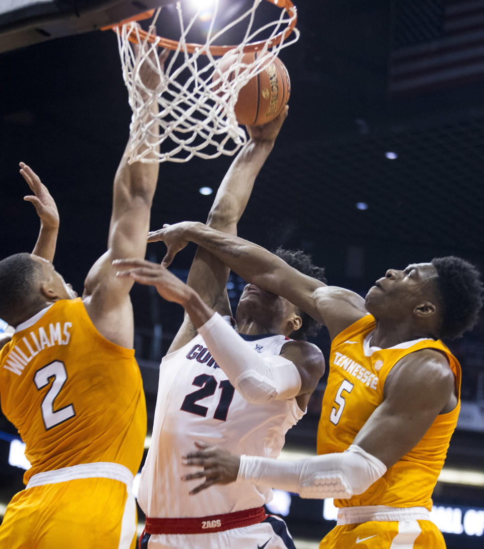 Gonzaga's Rui Hachimura (21) is fouled by Tennessee's Admiral Schofield (5) and Grant Williams (2) during the first half of an NCAA college basketball game Sunday, Dec. 9, 2018, in Phoenix. (AP Photo/Darryl Webb)