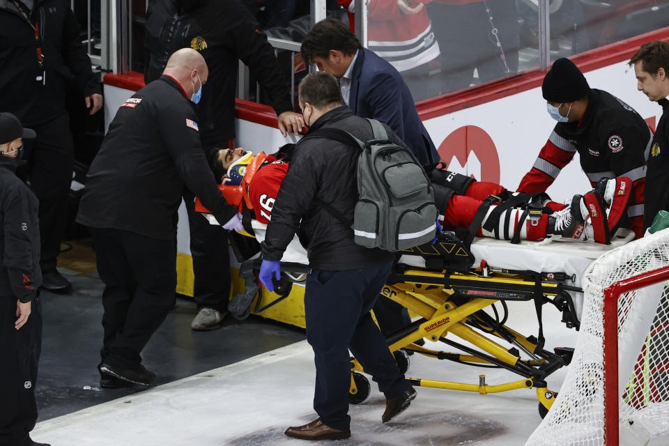 Chicago Blackhawks center Jujhar Khaira (16) leaves the ice on a stretcher after being knocked out by New York Rangers defenseman Jacob Trouba during the second period of an NHL hockey game, Tuesday, Dec. 7, 2021, in Chicago. (AP Photo/Kamil Krzaczynski)