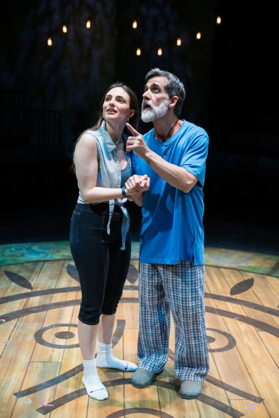 Emily Garcia Carrerou as María Elena García, left, listens as Carlos Orizondo’s Tío Manolo describes the natural wonders of Puerto Rico in “La Gringa” at the Arsht Center.