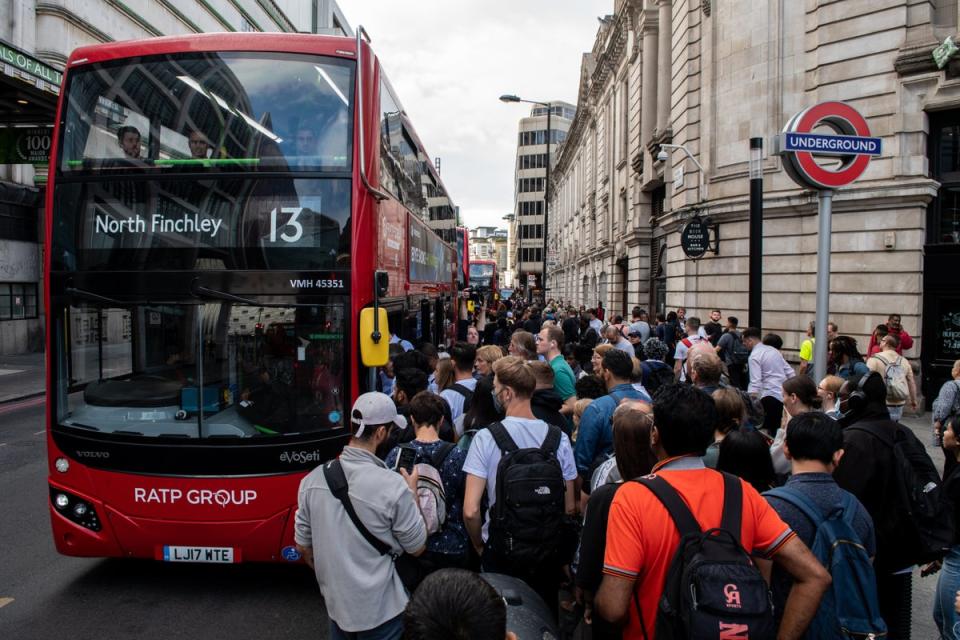 19 August 2022: Commuters queue for buses outside Victoria underground train station which is closed due to strike action (Getty)