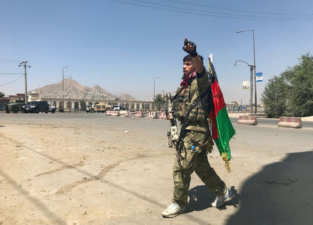 A member of the Afghan security forces keeps watch at the site of an attack in Kabul, Afghanistan August 21, 2018. REUTERS/Mohammad Ismail