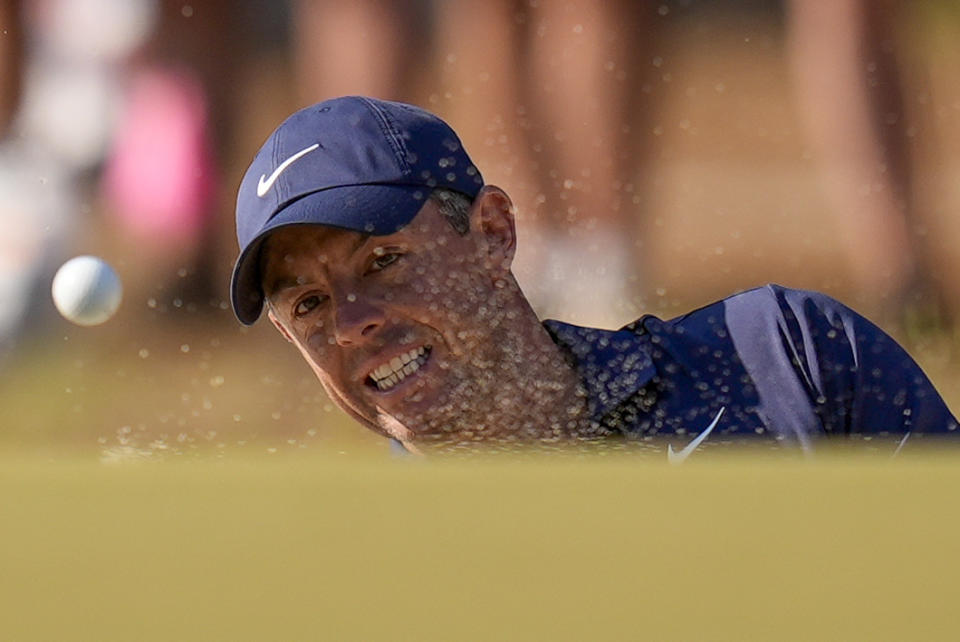 Rory McIlroy, of Northern Ireland, hits from the bunker on the 10th hole during the third round of the U.S. Open golf tournament Saturday, June 15, 2024, in Pinehurst, N.C. (AP Photo/Mike Stewart)