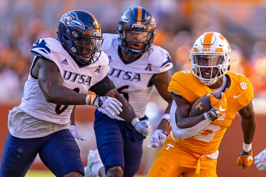 Tennessee running back Dylan Sampson (6) outruns UTSA safety Rashad Wisdom (0) during the first half of an NCAA college football game Saturday, Sept. 23, 2023, in Knoxville, Tenn. (AP Photo/Wade Payne)