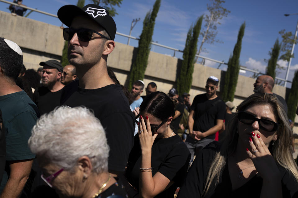 Mourners attend the funeral of the Israeli woman Shiraz Tamam, killed by Hamas militants while attending a music festival at a cemetery in Holon, central Israel, Tuesday, Oct. 17, 2023. (AP Photo/Petros Giannakouris