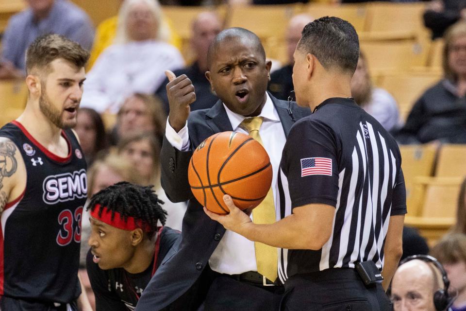 Missouri head coach Dennis Gates, center, argues a call with the official, right, in front of Southeast Missouri State's Dylan Branson, left, during the second half of a game Dec. 4 in Columbia, Missouri.
