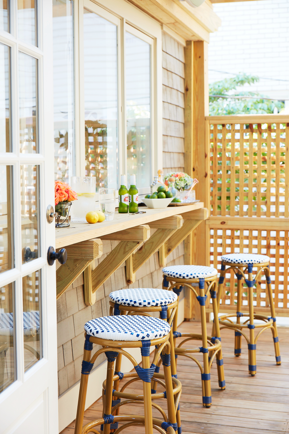 outdoor living space with counter and bar stools