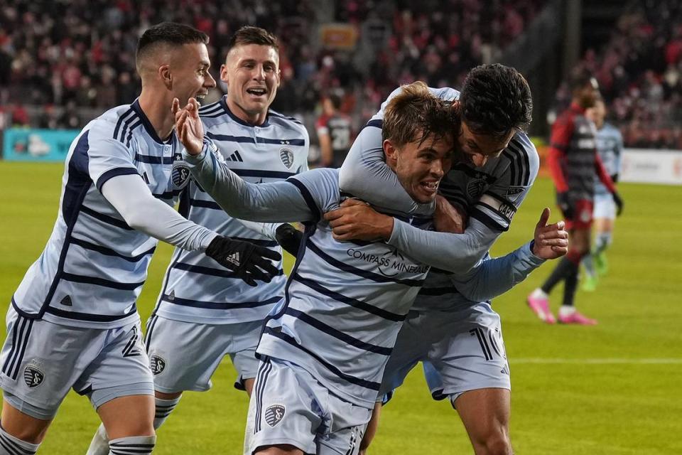 Sporting Kansas City midfielder Jake Davis (17) celebrates with teammates after scoring a goal against Toronto FC at BMO Field on March 30, 2024.