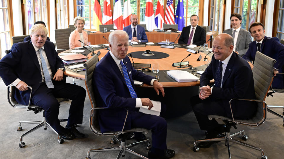 Clockwise from left, Fumio Kishida (covered), Prime Minister of Japan, Ursula von der Leyen, President of the European Commission, Charles Michel, President of the European Council, Mario Draghi, Prime Minister of Italy, Justin Trudeau, Prime Minister of Canada, Emmanuel Macron, Prime Minister of France, German Chancellor Olaf Scholz, US President Joe Biden and Boris Johnson, Prime Minister of the United Kingdom sit at the first working session in Castle Elmau in Kruen, near Garmisch-Partenkirchen, Germany, on Sunday, June 26, 2022. The Group of Seven leading economic powers are meeting in Germany for their annual gathering Sunday through Tuesday. (John MacDougall/Pool Photo via AP)