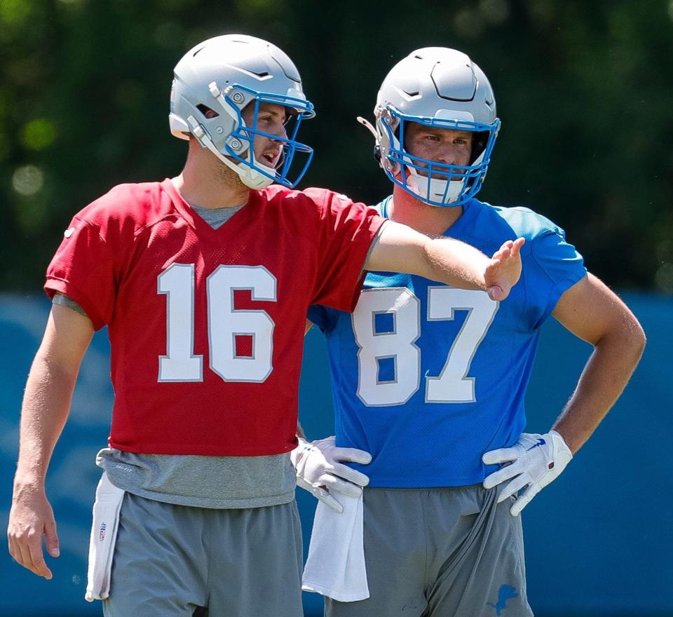 Detroit Lions quarterback Jared Goff (16) talks to tight end Sam LaPorta (87) after practice during OTAs at Detroit Lions headquarters and training facility in Allen Park on Thursday, May 30, 2024.