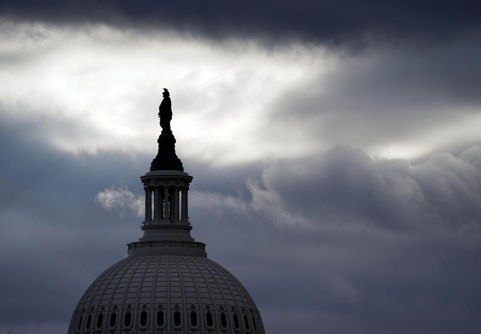 The Statue of Freedom by Thomas Crawford, atop the dome of the U.S. Capitol, is shown ahead of the inauguration of President-elect Joe Biden and Vice President-elect Kamala Harris, Sunday, Jan. 17, 2021, in Washington. (AP Photo/Julio Cortez)