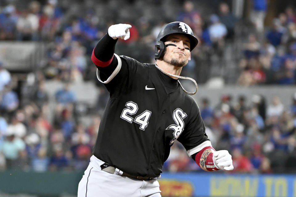 Chicago White Sox catcher Yasmani Grandal (24) celebrates his fourth-inning home run as he round the bases during a baseball game against the Texas Rangers in Arlington Texas, Sunday, Sept. 19, 2021. (AP Photo/Matt Strasen)