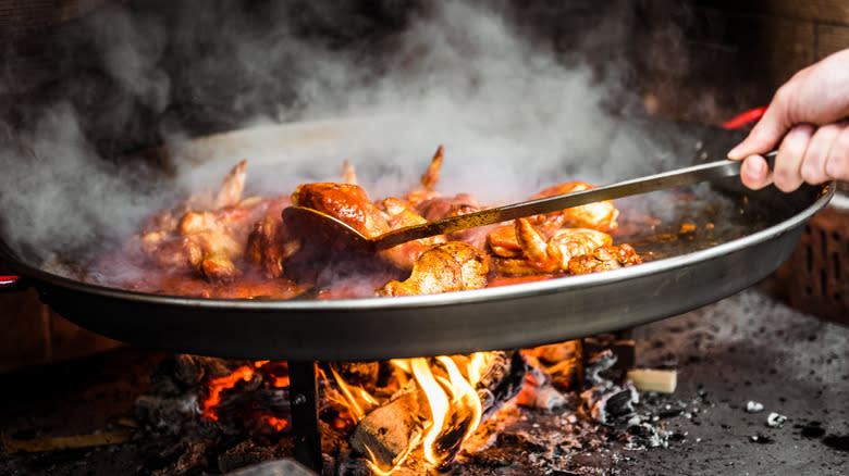 open flame cooking paella