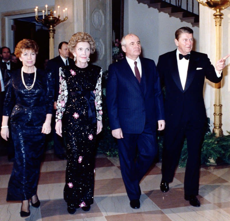 President Ronald Reagan (R) and first lady Nancy Reagan (2nd-L) escort their guests, Soviet leader Mikhail Gorbachev (2nd-R) and his wife Raisa, into a State Dinner at the White House on December 8, 1987. On December 7, 1987, Gorbachev became the first Soviet leader to officially visit the United States since 1973. UPI File Photo
