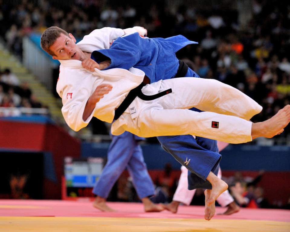 Nicolas Delpopolo of United States catches Dirk Van Tichelt of Belgium with a leg sweep to reach the quarter-finals in the Men's -73kg Judo on Day 3 of the London 2012 Olympic Games at ExCeL on July 30, 2012 in London, England. (Photo by David Finch/Getty Images)