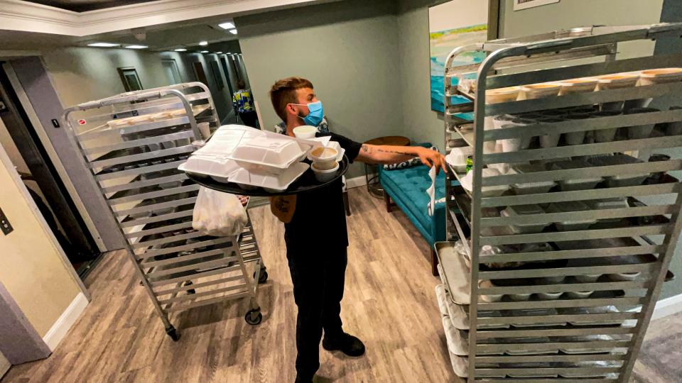 Jonathan Leal, dining room hospitality, fills a tray of food to be delivered to a resident’s apartment. He has been working here for about two months, but had worked here for about two years before. The current labor market is leaving health care facilities understaffed and workers totally burnt out. Aviva Senior Living in Sarasota is having unprecedented hiring trouble. The facility has 10 full-time nursing positions open and getting hospitality staff has been such an issue that they’ve had to start serving independent living residents in their homes instead of in the communal dining room for social time.