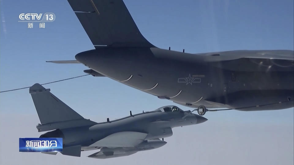 In this image taken from video footage run Saturday, April 8, 2023 by China's CCTV, a Chinese fighter jet performs an mid-air refueling maneuver at an unspecified location. The Chinese military announced exercises around Taiwan on Saturday in a new act of retaliation for a meeting between the U.S. House of Representatives speaker and the president of the self-ruled island democracy claimed by Beijing as part of its territory. (CCTV via AP)