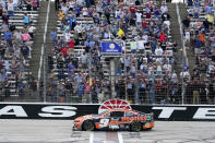 Chase Elliott crosses the finish line to win a NASCAR Cup Series auto race at Texas Motor Speedway in Fort Worth, Texas, Sunday, April 14, 2024. (AP Photo/Larry Papke)