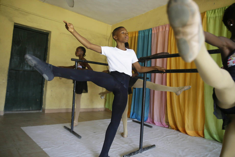 Ballet dancer Anthony Mmesoma Madu rehearses in Lagos, Nigeria on Aug. 18, 2020. Cellphone video showing the 11-year-old dancing barefoot in the rain went viral on social media. Madu’s practice dance session was so impressive that it earned him a ballet scholarship with the American Ballet Theater in the U.S. (AP Photo/Sunday Alamba)